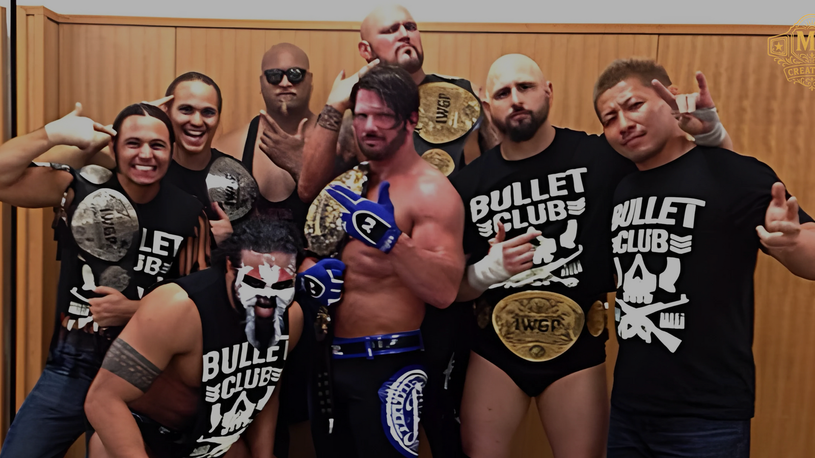 The Bullet Club faction posing with multiple titles, including the prestigious IWGP Heavyweight Championship.