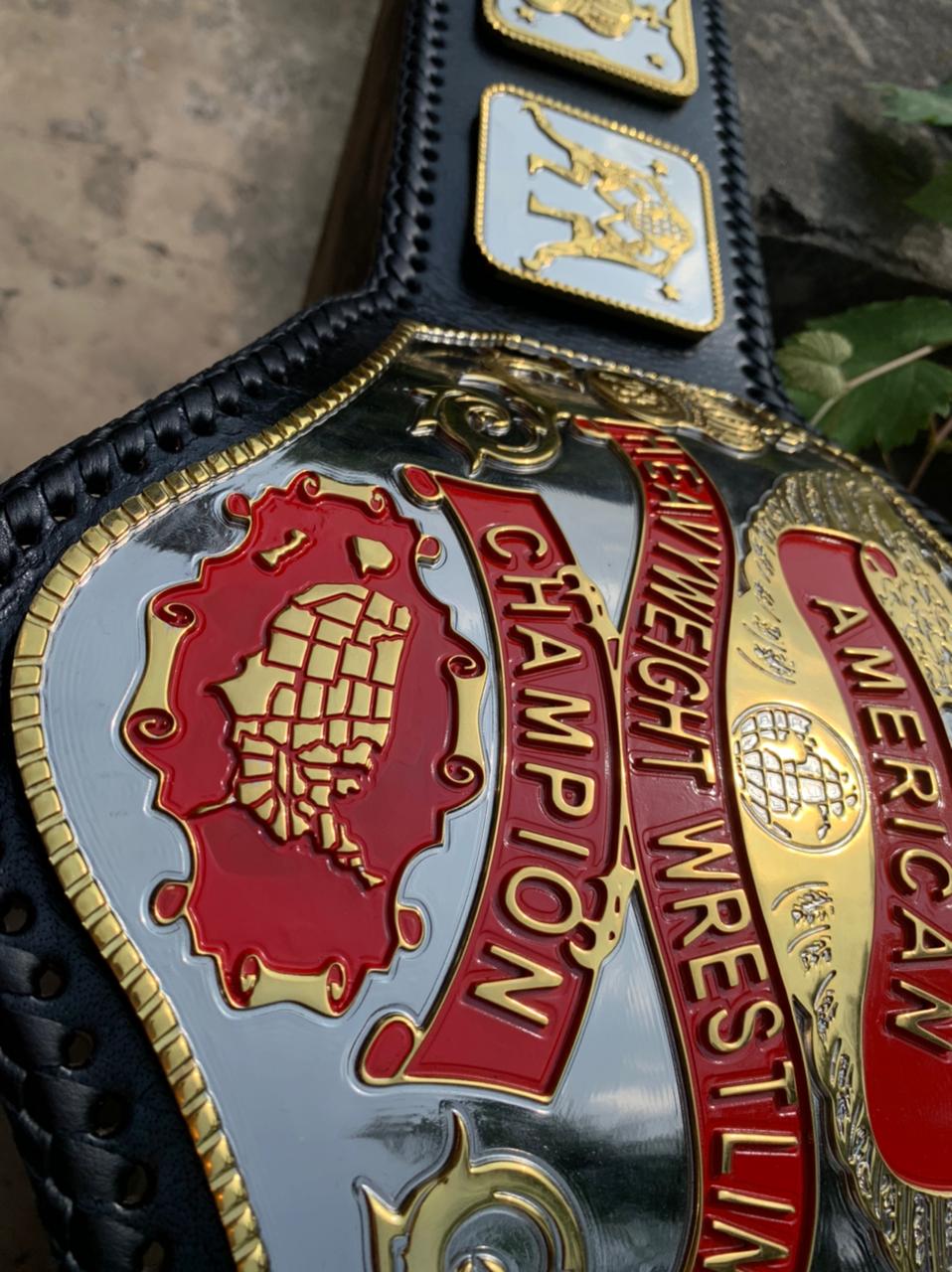 American Heavyweight Championship replica belt, centre plate banners and red map close-up