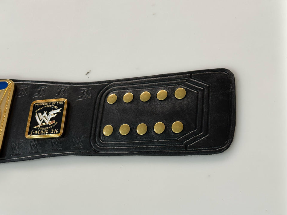 WWF Intercontinental Oval Globe Championship replica belt, strap plate and snap studs close-up