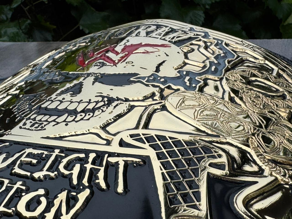 WWF Smoking Skull Championship replica belt, centre plate snake and mesh detail close-up
