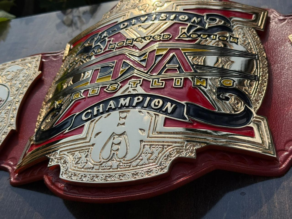 TNA X Division Championship replica belt, centre plate close-up