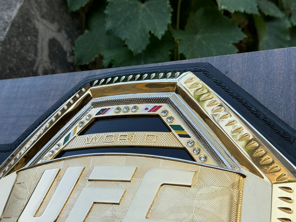 UFC World Champion (Octagon Design) replica belt, centre plate top close-up