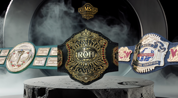 A collection of three detailed wrestling belts on display, perfect for collectors and fans.