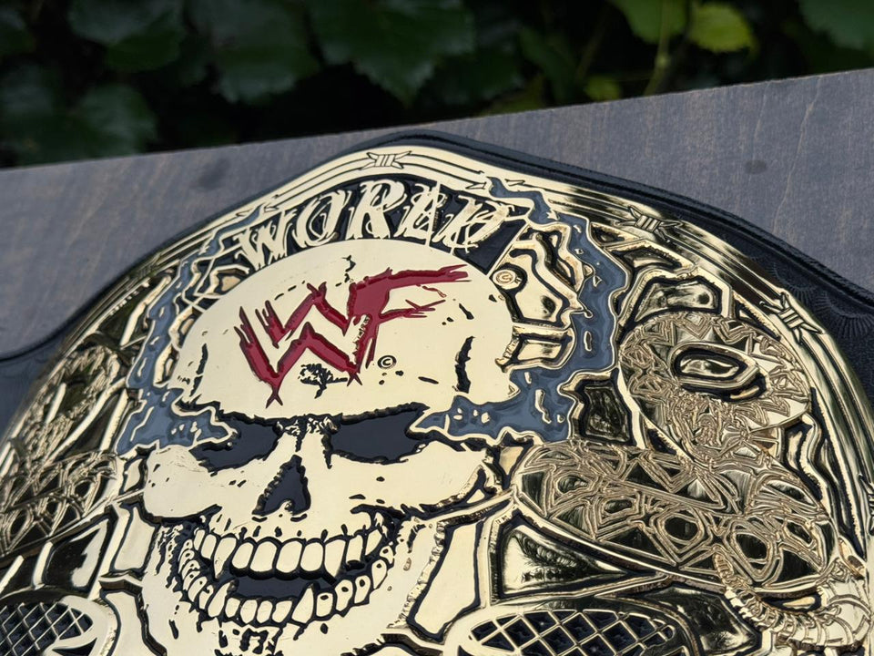 WWF Smoking Skull Championship replica belt, skull with red WWF logo close-up
