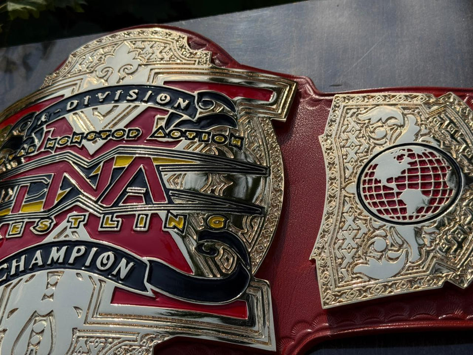 TNA X Division Championship replica belt, centre plate and side plate close-up