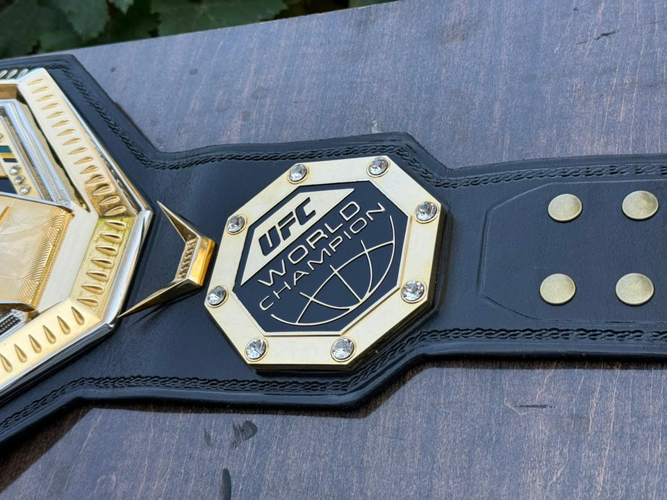 UFC World Champion (Octagon Design) replica belt, side plate and chevron close-up