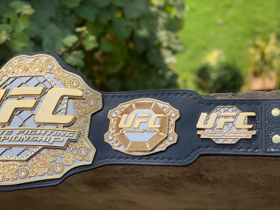 UFC Championship replica belt, centre plate and side plate close-up