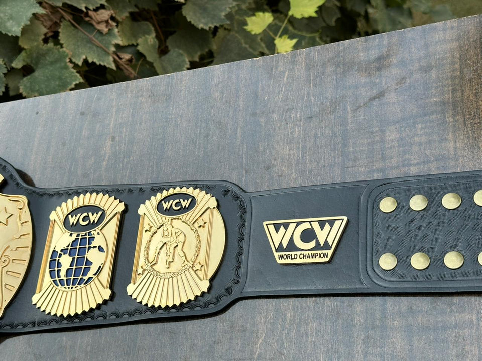 WCW World Heavyweight Championship replica belt, side plates and strap plate close-up