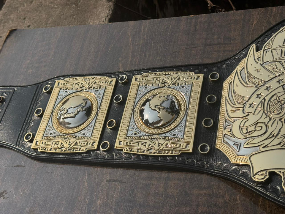 TNA World Heavyweight Championship replica belt, side plates and eagle wing close-up